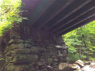 Creamery Bridge stone abutment under timber deck
