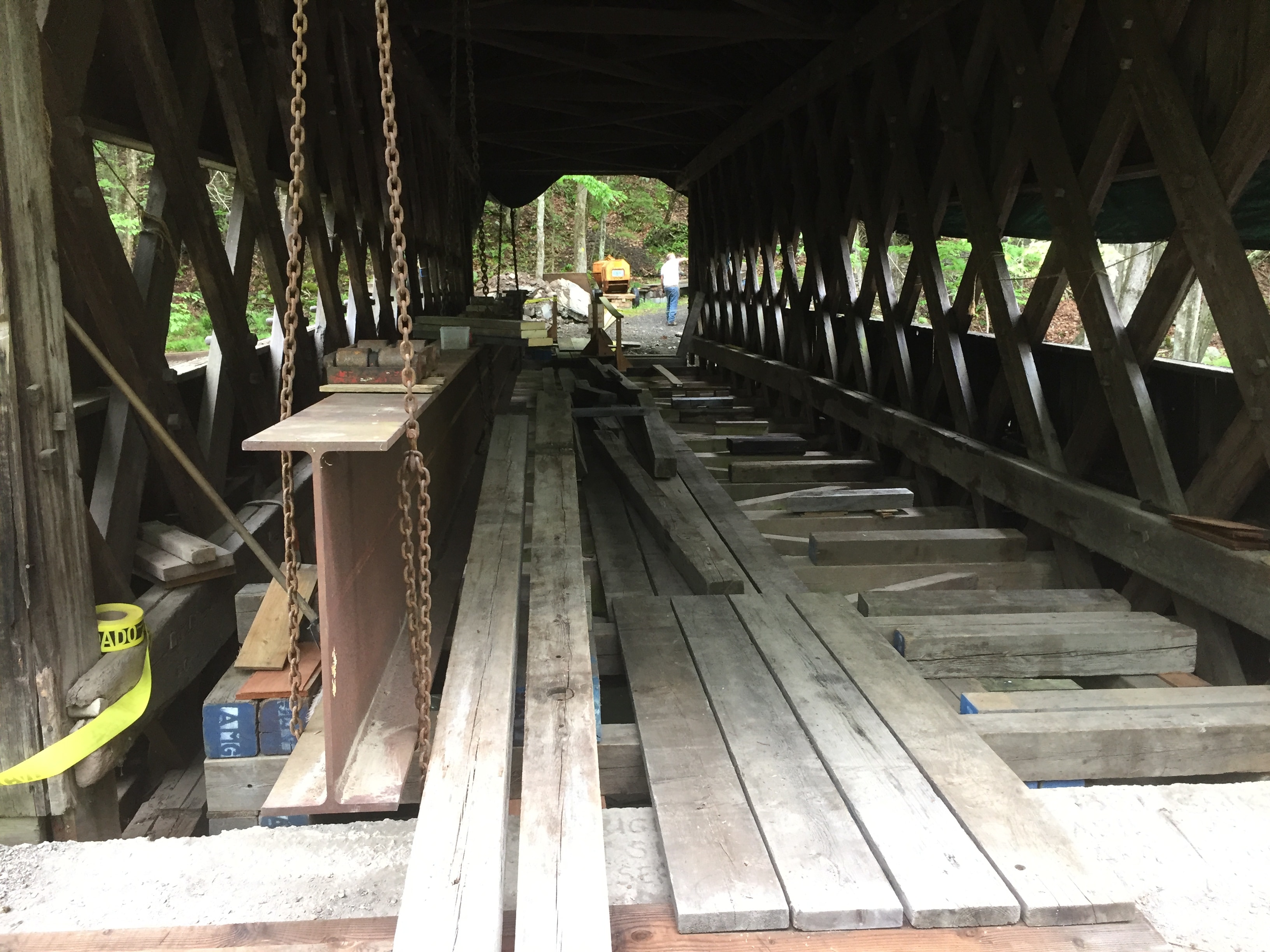 Ashokan bridge interior under construction with steel beam and lumber
