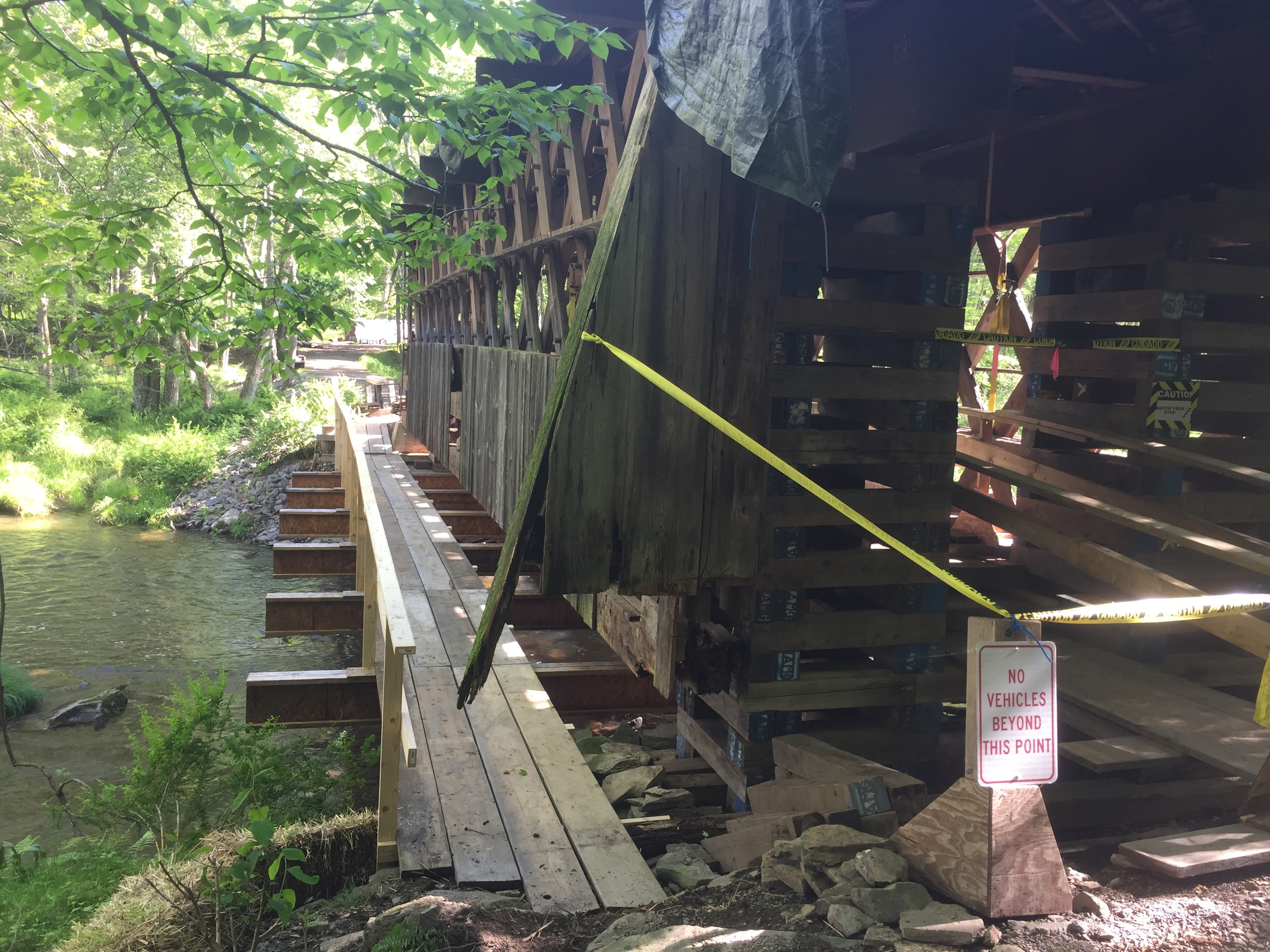 Ashokan bridge exterior side view over stream with caution tape