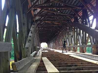 Blair covered bridge interior showing timber truss structure before restoration
