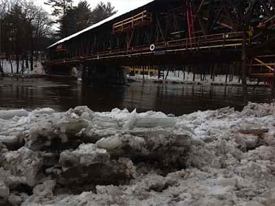 Blair bridge on steel support falsework over icy river in winter