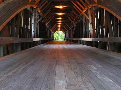 Blair covered bridge interior after restoration showing timber arches and new deck