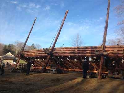 Gold Mine covered bridge in winter with snow on roof and ground