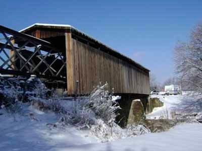 Johnson Creek covered bridge in winter snow landscape