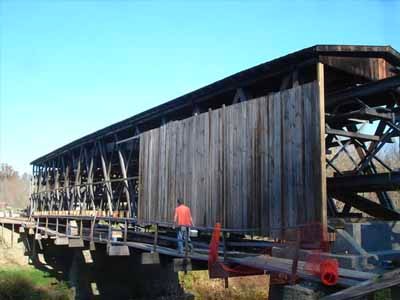 Johnson Creek covered bridge exterior on steel support falsework during restoration