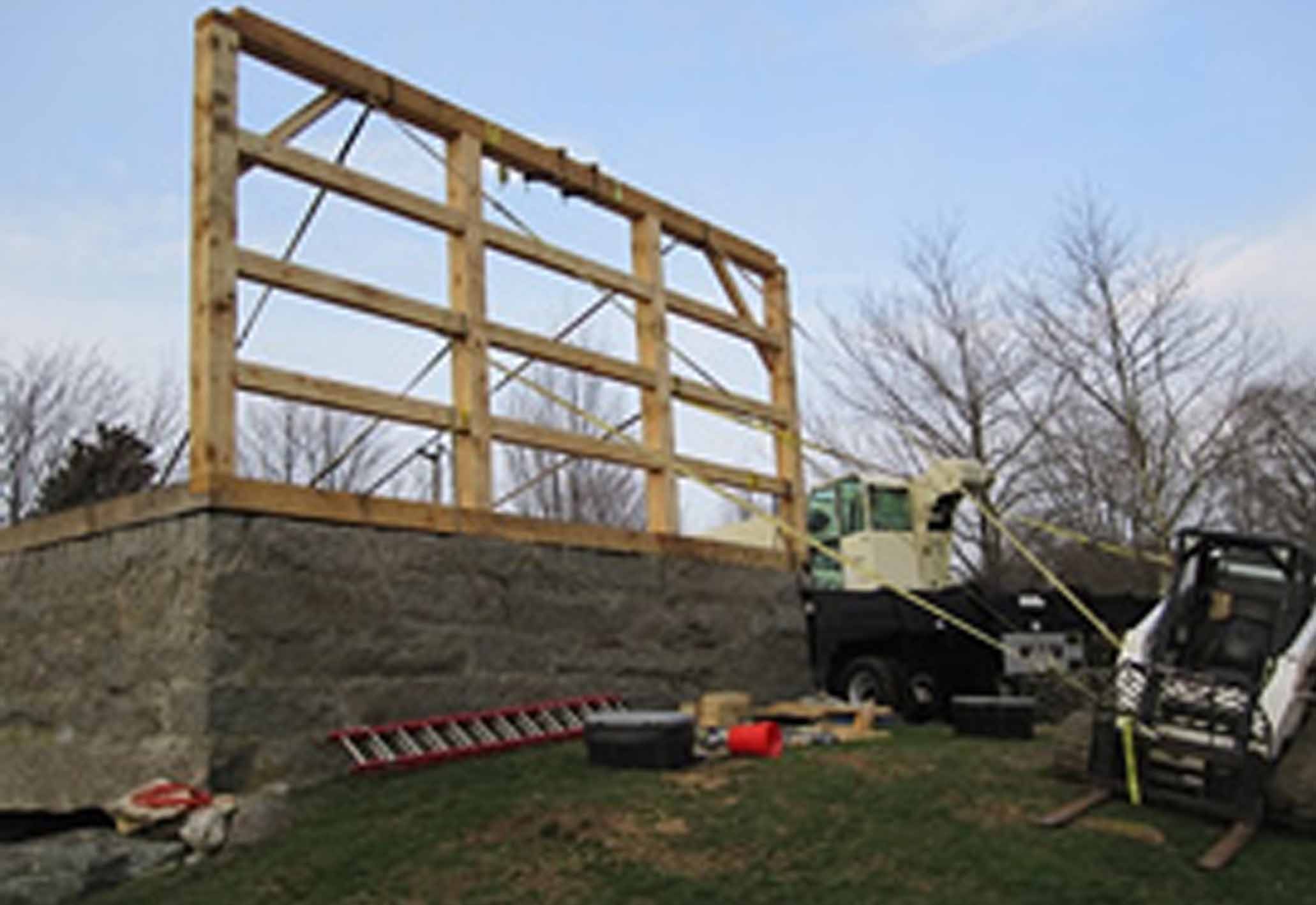 Timber frame construction with crane and wooden frame